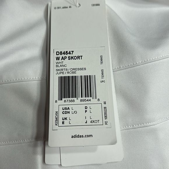 ADIDAS white skort with pleats on the bottom  half . Then two horizontal bands. - Picture 9 of 11